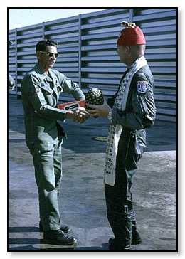 Crew chief gets some beer and thanks.