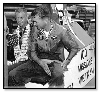 Monty Pharmer, with the scarf, and Gary Durkee after finishing their 100 missions.<br />